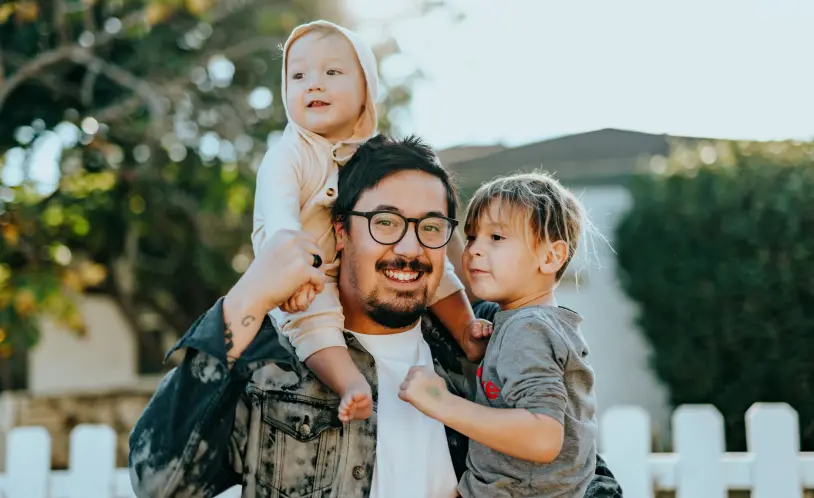 Dad holding kids